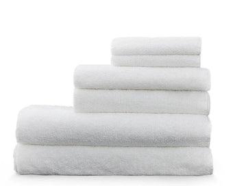 Load image into Gallery viewer, Snow - white Enso washcloths and hand towels stacked on top of our bamboo luxury towels